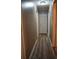 Hallway with wood-look flooring, neutral paint, and access to multiple rooms at 4120 Highway 92, Acworth, GA 30102