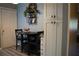 Eat-in kitchen features a breakfast nook with storage, white pantry, and decorative wall hangings at 4120 Highway 92, Acworth, GA 30102