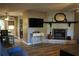 Open living room with stone fireplace, hardwood flooring, and adjoined dining area at 4120 Highway 92, Acworth, GA 30102
