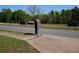 Street view showing a mailbox and passing cars, indicating convenient access and visibility for residents and visitors at 4120 Highway 92, Acworth, GA 30102