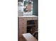 A makeup vanity area with illuminated mirror and storage shelves in a corner of the bedroom at 4120 Highway 92, Acworth, GA 30102