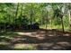 Wooded area with a small shed and space to gather at 4120 Highway 92, Acworth, GA 30102