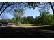Expansive yard with mature trees and ample parking, ideal for outdoor activities and easy access for residents and visitors at 4120 Highway 92, Acworth, GA 30102