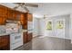 Bright kitchen with stainless appliances, tile backsplash, wood cabinets, and adjacent dining area at 5333 Pine Valley Rd, Powder Springs, GA 30127