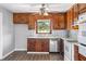 Well-lit kitchen with wood cabinets, stainless steel appliances and a garden window at 5333 Pine Valley Rd, Powder Springs, GA 30127