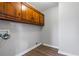 Simple, but functional laundry area with storage cabinets and hookups for washer and dryer at 5333 Pine Valley Rd, Powder Springs, GA 30127