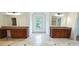Bathroom with dual vanities, granite countertops, and tile flooring at 10340 Meadow Crest Ln, Alpharetta, GA 30022