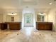 Large bathroom featuring dual vanities, granite countertops, and tile flooring at 10340 Meadow Crest Ln, Alpharetta, GA 30022
