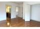 Bright bedroom featuring hardwood floors, neutral walls, and doorways to the hallway and bathroom at 10340 Meadow Crest Ln, Alpharetta, GA 30022
