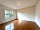 Bedroom with hardwood floors and natural light at 10340 Meadow Crest Ln, Alpharetta, GA 30022