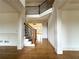 Grand foyer with hardwood floors, elegant staircase, and decorative columns and moldings at 10340 Meadow Crest Ln, Alpharetta, GA 30022