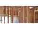 Interior view of new home construction showing wooden framing at 10340 Meadow Crest Ln, Alpharetta, GA 30022