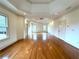 Spacious living room featuring hardwood floors and a tray ceiling at 10340 Meadow Crest Ln, Alpharetta, GA 30022