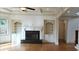 Living room with fireplace, built-in shelves, and coffered ceiling at 10340 Meadow Crest Ln, Alpharetta, GA 30022