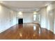 Bright living room with hardwood floors, fireplace, and coffered ceilings at 10340 Meadow Crest Ln, Alpharetta, GA 30022