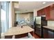 Granite kitchen island and stainless steel appliances with city views at 855 Peachtree Ne St # 2412, Atlanta, GA 30308