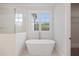 Bathroom with free-standing bathtub and glass shower at 325 Mont Harmony Sw Rd, Powder Springs, GA 30127