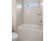 Bathroom with a shower/tub and light tile at 325 Mont Harmony Sw Rd, Powder Springs, GA 30127