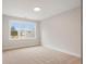 Well-lit bedroom with carpeted floors and a large window with a neighborhood view at 325 Mont Harmony Sw Rd, Powder Springs, GA 30127