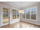 Breakfast nook featuring hardwood floors, door to deck, and abundant natural light at 325 Mont Harmony Sw Rd, Powder Springs, GA 30127