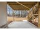 Ground-level patio under the house with stairs leading up to the deck at 325 Mont Harmony Sw Rd, Powder Springs, GA 30127