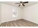 Spacious bedroom with ceiling fan and window at 29 Autumn Ne Pl, White, GA 30184