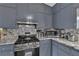 Stainless steel appliances and granite countertops feature in this kitchen at 1531 Harbour Oaks Rd, Tucker, GA 30084