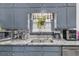 Granite countertops and stainless steel appliances in this well-equipped kitchen at 1531 Harbour Oaks Rd, Tucker, GA 30084