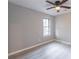 Bright bedroom with ceiling fan and new flooring at 3814 Whaley Ct, Snellville, GA 30039