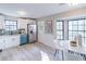 Modern kitchen with white cabinets, teal dishwasher, and granite countertops at 3814 Whaley Ct, Snellville, GA 30039