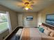 Main bedroom with a ceiling fan and large window at 1959 Bandera Dr, Decatur, GA 30032