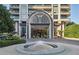 Elegant high-rise building with fountain and landscaped grounds at 750 Park Ne Ave # 13W, Atlanta, GA 30326
