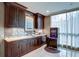 Well-equipped community kitchen with dark wood cabinets at 750 Park Ne Ave # 13W, Atlanta, GA 30326