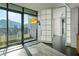 Bright dining area with city views and glass partitions at 750 Park Ne Ave # 13W, Atlanta, GA 30326
