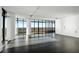 Modern living room with dark hardwood floors and city views at 750 Park Ne Ave # 13W, Atlanta, GA 30326