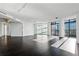 Spacious living room with floor-to-ceiling windows and hardwood floors at 750 Park Ne Ave # 13W, Atlanta, GA 30326