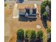 Expansive aerial view of gray home with a deck overlooking the backyard and partial driveway at 1019 Walnut Creek Dr, Woodstock, GA 30188