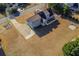 Aerial view of a home with a long drive, large backyard, and well-maintained landscaping, showcasing its curb appeal at 1019 Walnut Creek Dr, Woodstock, GA 30188