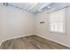 Finished basement room with painted walls and modern flooring and a window at 1019 Walnut Creek Dr, Woodstock, GA 30188