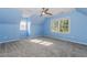 Light and airy bedroom with blue walls and new carpet at 1019 Walnut Creek Dr, Woodstock, GA 30188