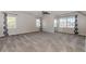 Expansive room featuring two windows with black and white curtains plus wall-mounted mirror and neutral colors at 1019 Walnut Creek Dr, Woodstock, GA 30188