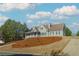 House exterior with landscaping and a long driveway at 1019 Walnut Creek Dr, Woodstock, GA 30188