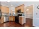 Bright kitchen features stainless steel appliances, backsplash and hardwood floors at 1019 Walnut Creek Dr, Woodstock, GA 30188