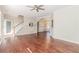 Bright living room features hardwood floors, stairs, archway, and natural light at 1019 Walnut Creek Dr, Woodstock, GA 30188