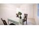 Bright dining area with table, chairs, and view of storage in neutral color tones provides a cozy eating space at 4001 Red Oak Dr, Atlanta, GA 30340