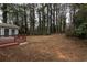 Large backyard offering a private and wooded setting at 1472 Silver Maple Sw Ct, Lilburn, GA 30047