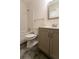 Clean bathroom with a vanity, toilet, and bathtub at 1472 Silver Maple Sw Ct, Lilburn, GA 30047