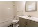 Updated bathroom with a vanity, bathtub, and tiled floor at 1472 Silver Maple Sw Ct, Lilburn, GA 30047