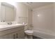 Clean bathroom with a tub, toilet, and vanity at 1472 Silver Maple Sw Ct, Lilburn, GA 30047