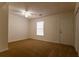 Bright bedroom featuring a window and ceiling fan at 1472 Silver Maple Sw Ct, Lilburn, GA 30047